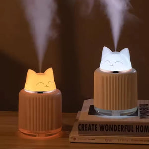 Cute cat-shaped portable mini humidifier with soft night light glow, compact size 