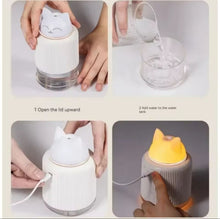 Cute cat-shaped portable mini humidifier with soft night light glow, compact size 