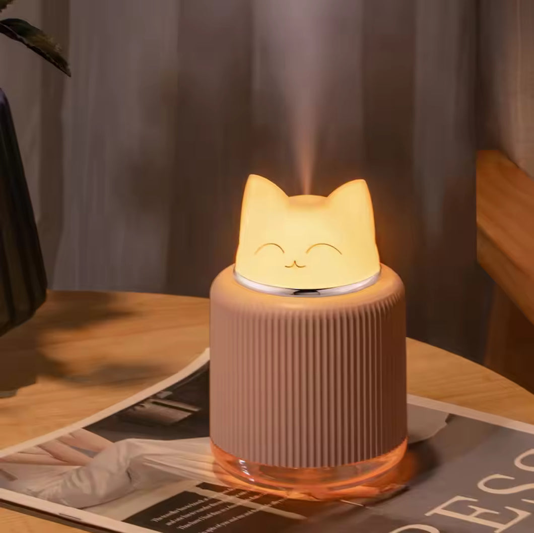 Cute cat-shaped portable mini humidifier with soft night light glow, compact size 